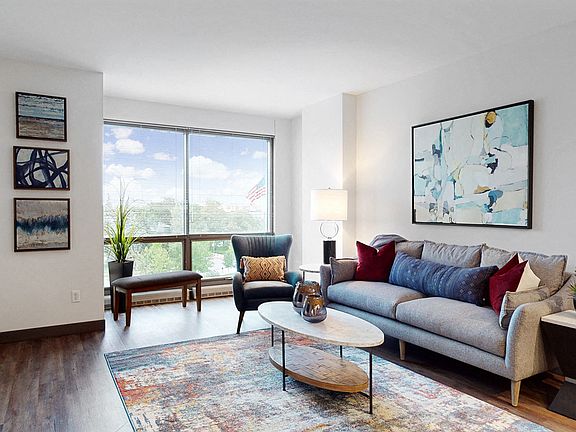 Large windows invite natural light, creating a bright and airy living space.