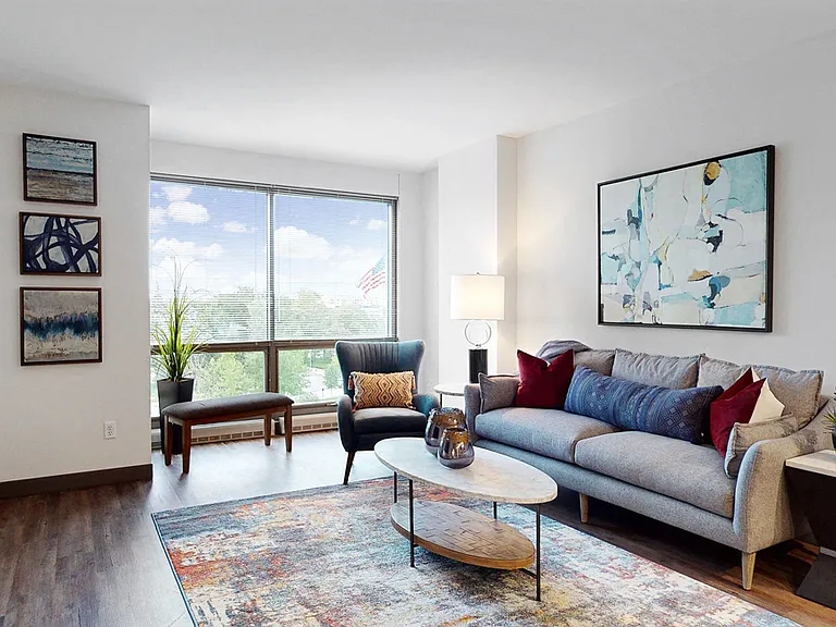 Large windows invite natural light, creating a bright and airy living space.