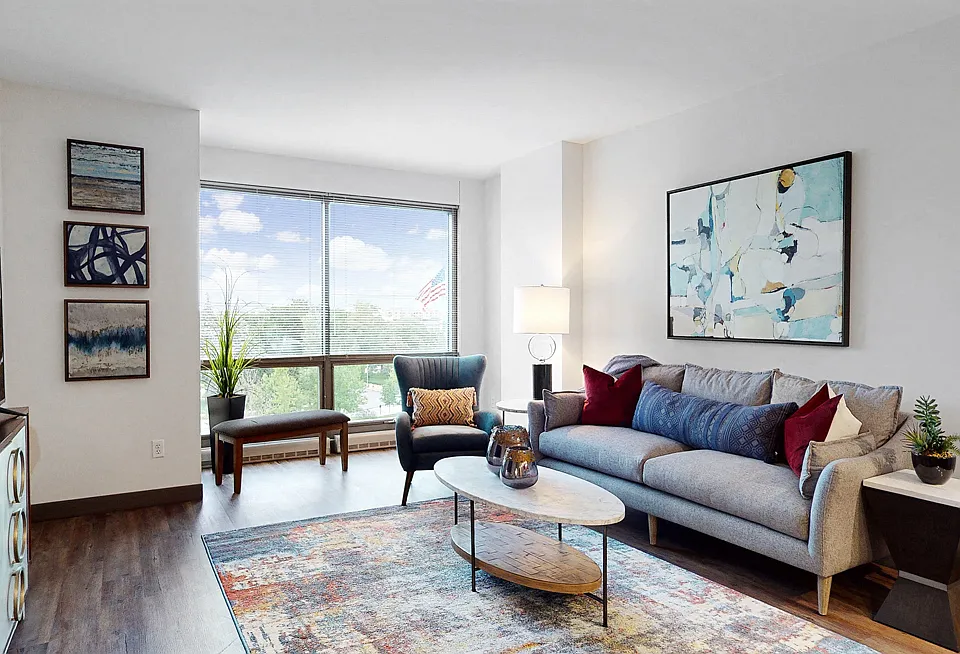 Large windows invite natural light, creating a bright and airy living space.