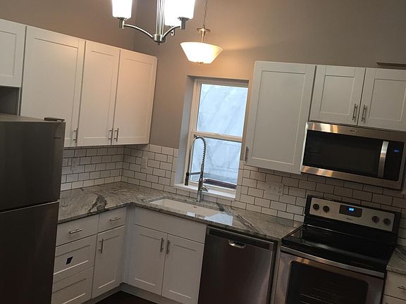 Fully stocked with toaster oven ,coffee makers, dishes, pots, and pans.