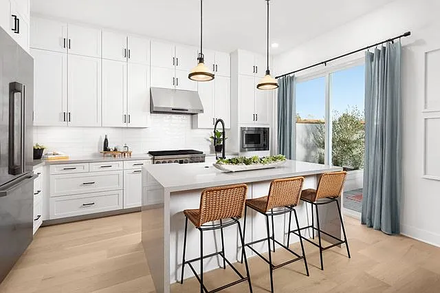 Kitchen - Floor to ceiling cabinets - Waterfall Island - View of Backyard