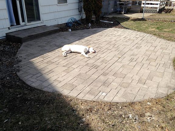 fenced in back yard with patio