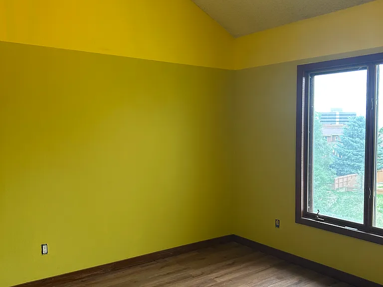 Bedroom #3. Upstairs on top floor. Large closet. Bright, spacious, beautiful view of lake in back.