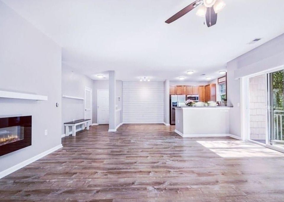 large living room with electric fireplace