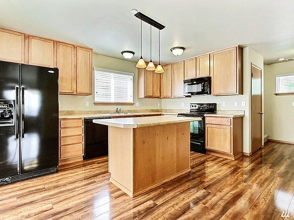 Open kitchen with pendant lights