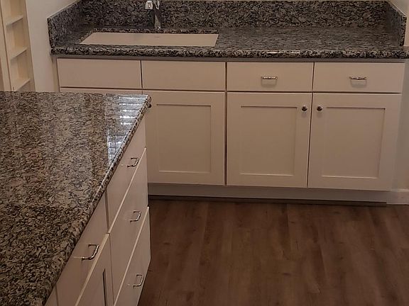 Brand new floors, cabinets, and counter tops.