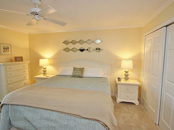 master bedroom with king and TV