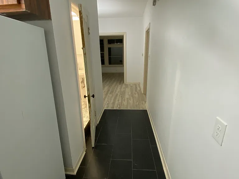 Hallway between kitchen & dinning room that connect to the bathroom.