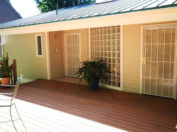 Primary Entrance located on the Upper Level of House. 400+ sq ft Entertainment Deck on East side (Hi