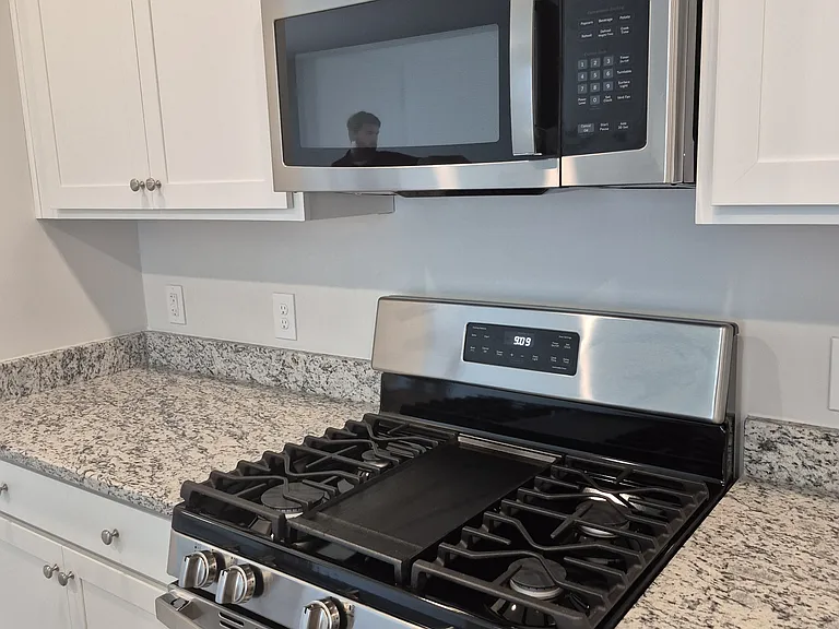 Kitchen with gas cooktop and microwave