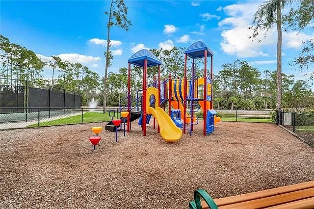 Families will love the colorful on-site playground, complete with slides, climbing structures, and shaded seating nearby. Surrounded by palm trees and located close to the tennis courts and lake.