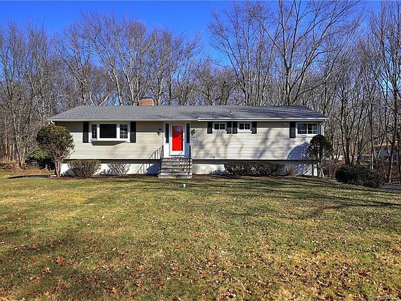 New blue stone front entry with pretty red door welcomes you!
