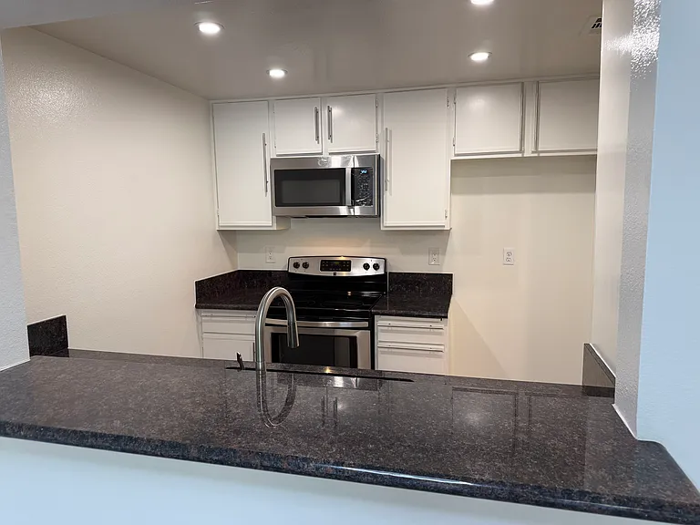 Microwave above the stove to save on counter space