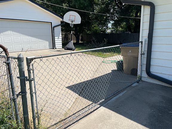Fenced backyard and garage