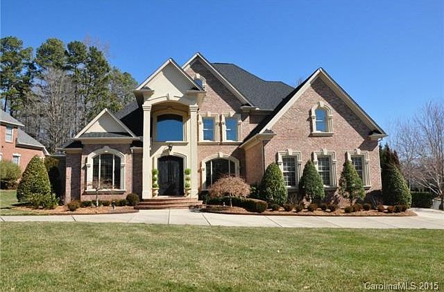Full brick custom home with circular and side driveways