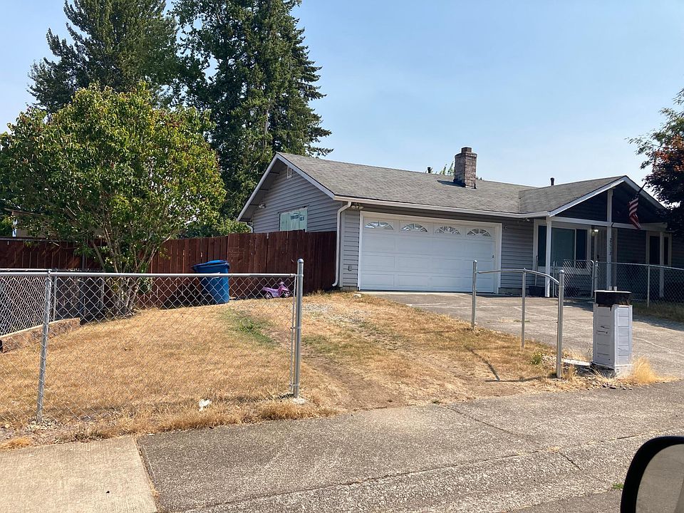 Fenced front and driveway