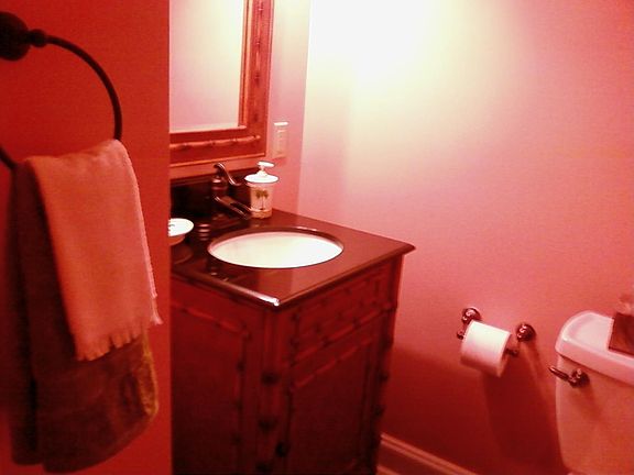 Powder room/ black granite floor/ sink