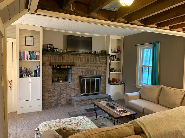 Livingroom shown with previous tenants furniture