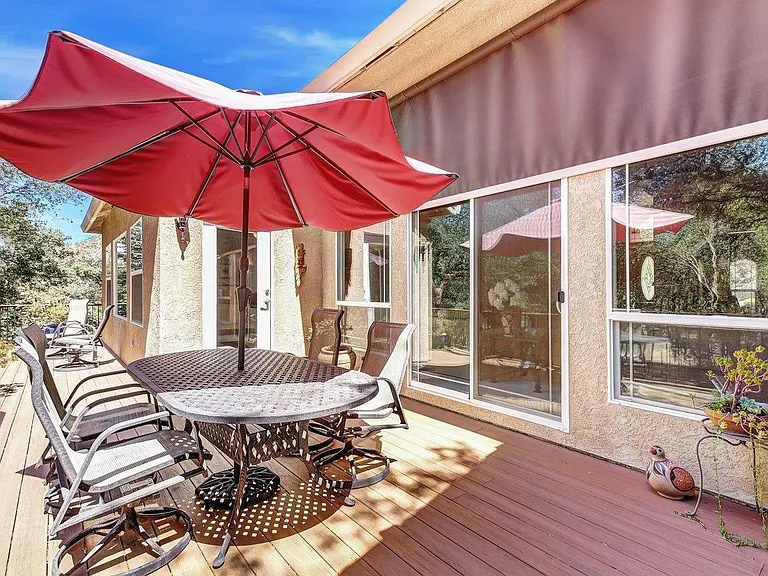 Back deck with wrought iron table that can be left