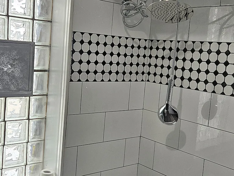 Newly tiled bathroom with new vanity
