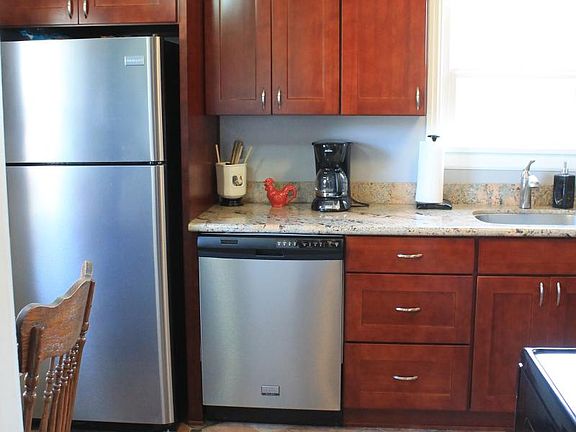 Updated kitchen with stainless appliances and granite