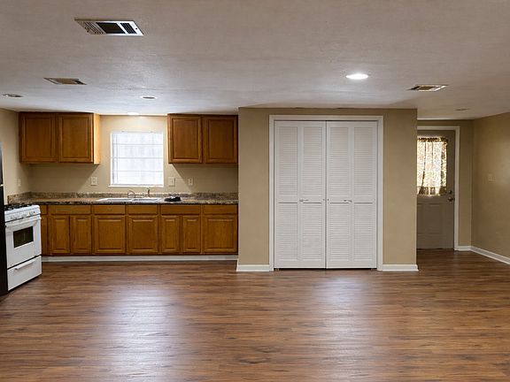 Looking at kitchen area, laundry, back door