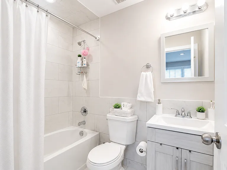Updated full bathroom with tiled tub and shower