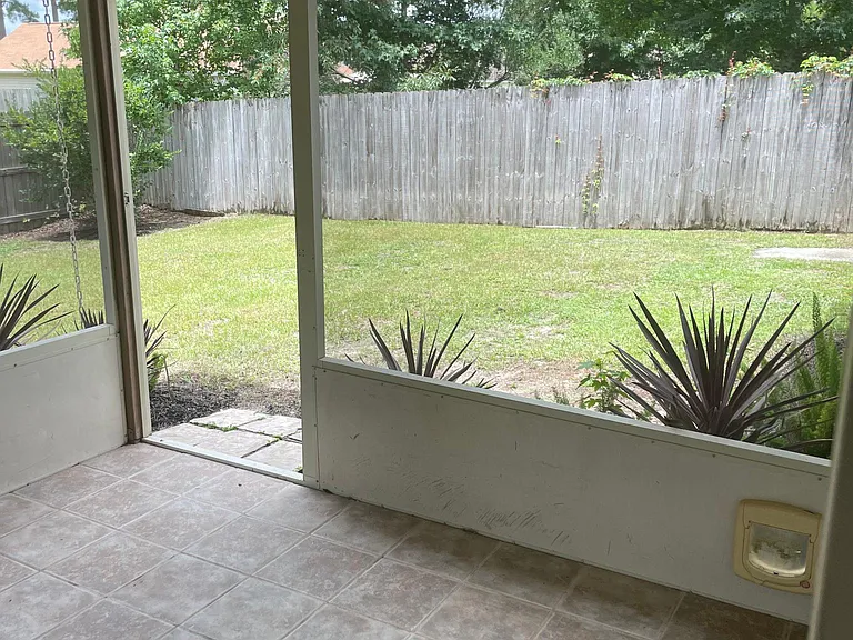 Screened porch with views of big backyard
