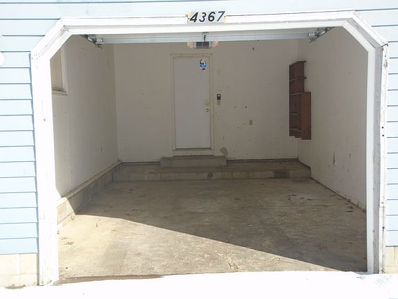 Garage with door to Kitchen