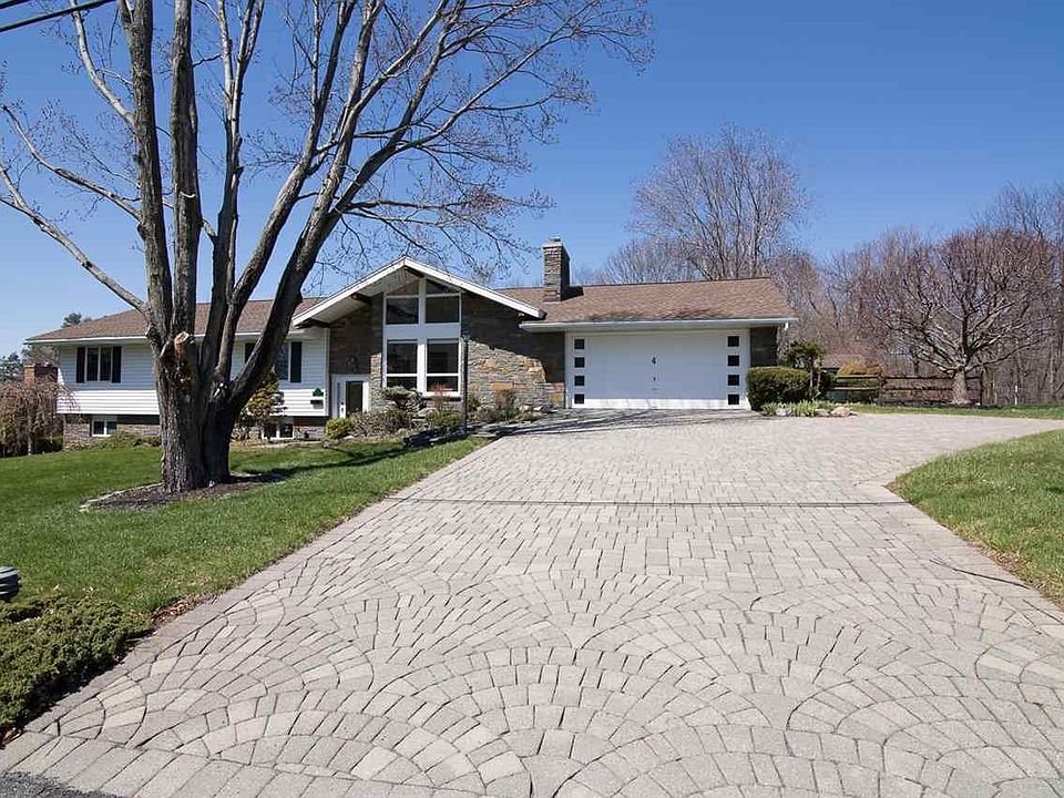 Oversized Garage, paver driveway...beautifully landscaped...
