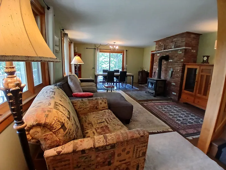 Spacious living area with sun and garden view