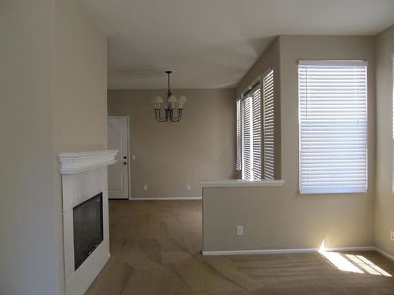 Living room with fireplace, adjacent family room or dining r