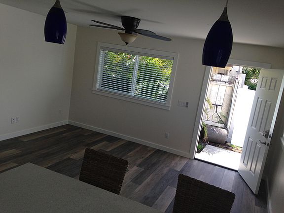 Living/dining room with breakfast bar and entryway
