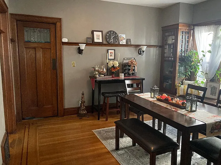 dining room looking toward back of apartment - swinging door to back hallway with stained glass window