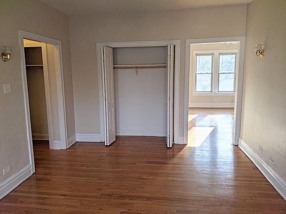Living room with closet view toward dining room