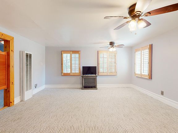 UNFURNISHED MASTER BEDROOM WITH BAR ROOM SHUTTERS LEADING TO SIDE OFFICE OR OPTIONAL ROOM