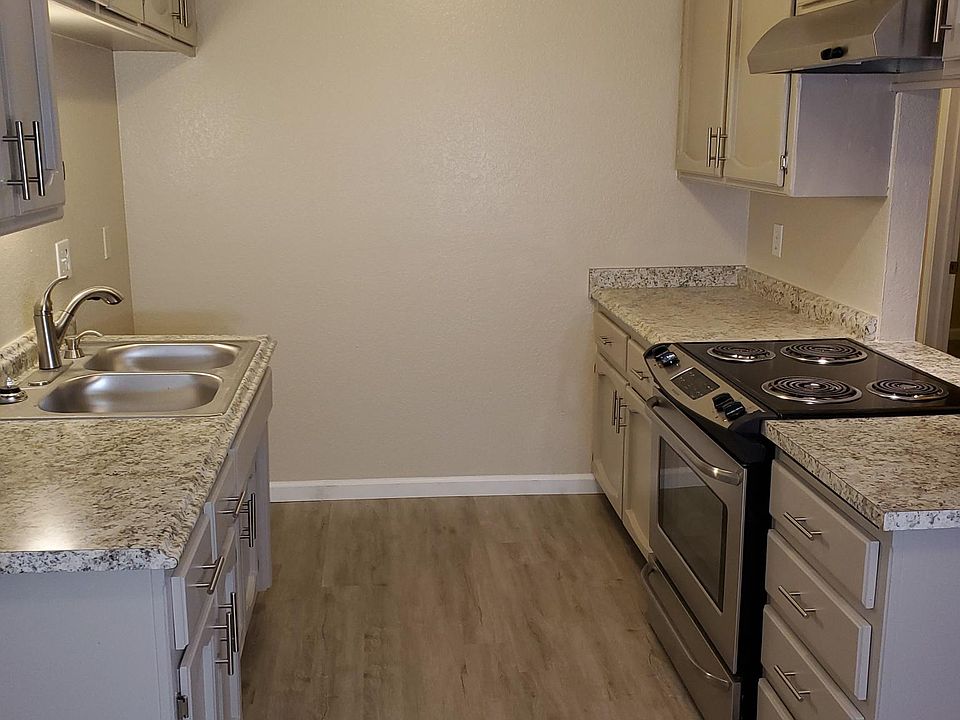 Kitchen - Slide in oven, brushed nickle hardware, energy efficient lighting.