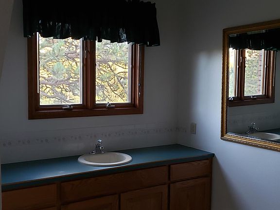 Oversized bathroom with bathtub and shower.