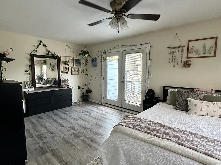 Third-floor bedroom showing exterior door to balcony