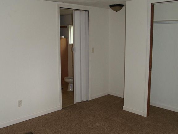 Bedroom onlooking private bathroom entrance