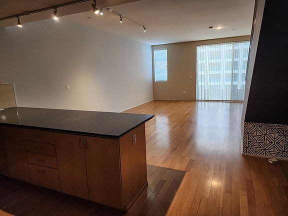 Grand room with sliding door from kitchen entry