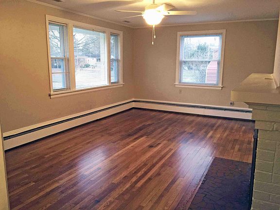 Living room with plenty of natural light and ceiling fan