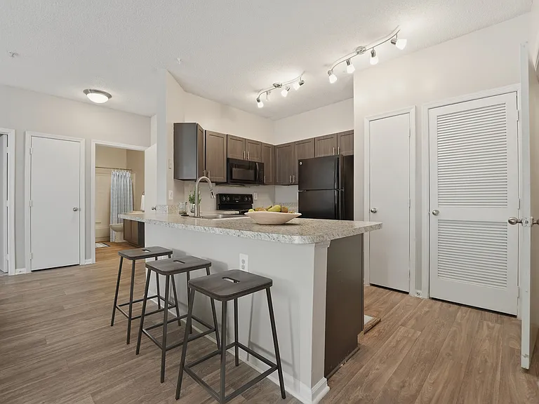 Welcome to Eagle Rock Apartments at Belcamp, where modern design meets comfort. This sleek kitchen features high-end appliances and stylish finishes, perfect for culinary enthusiasts. Elevate your lifestyle todayschedule a tour now!