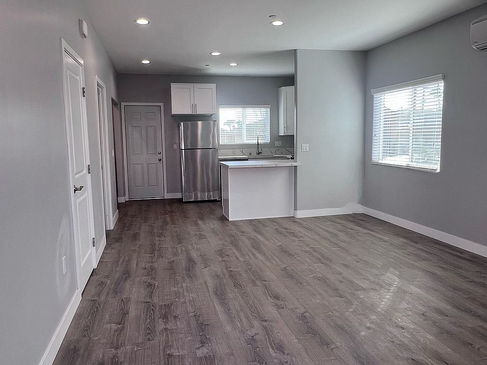 View from the entry way - Bright LED lights and lots of windows for natural light. Vinyl laminate flooring.