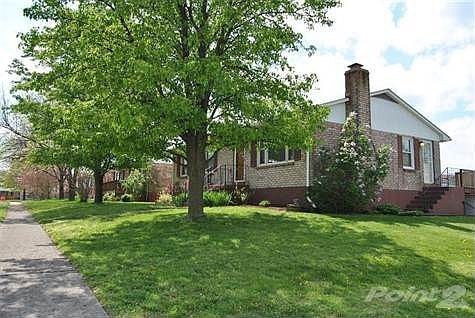 Attractive landscaping add to the curb appeal of this home