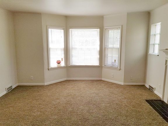 Large living room with a beautiful fireplace
