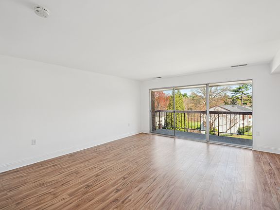Large open living room with balcony access