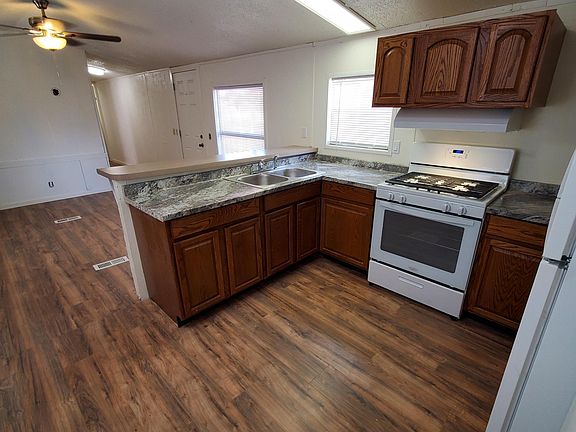 Kitchen with newer appliances and bar top