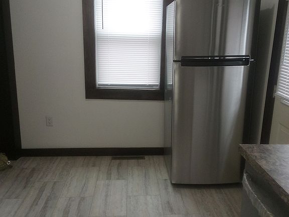 Kitchen with refrigerator