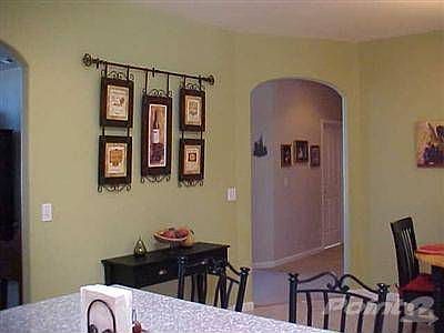 Farm sized kitchen is big enough for family dining.